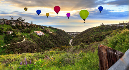 Hill top view of balloons from Park Street at sunset
