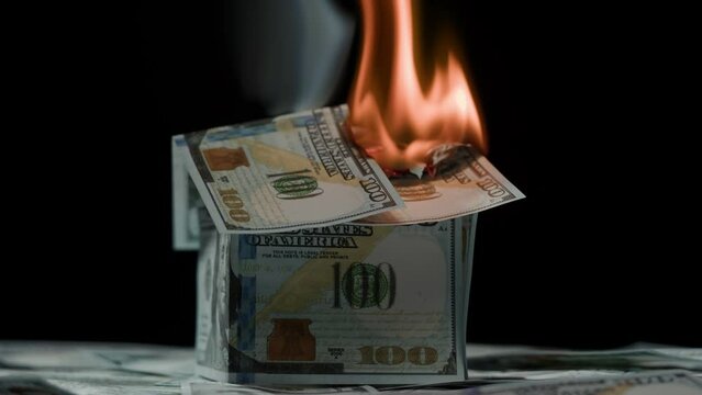 Burning of American 100 dollar banknotes on black background. Flame of fire from cash. Financial crisis and depressed economy. Paper money loss concept. 