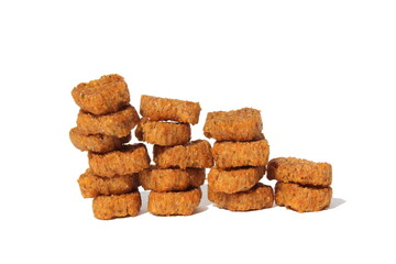 Crackers stacked in a stack stand on a white background.