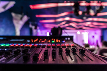 Close up, sound music mixer control panel on blurred background.