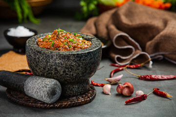chili paste in a mortar Decorated with beautiful side dishes.