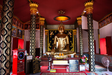 Ancient buddha statue in antique ubosot for thai people travelers travel visit respect praying...