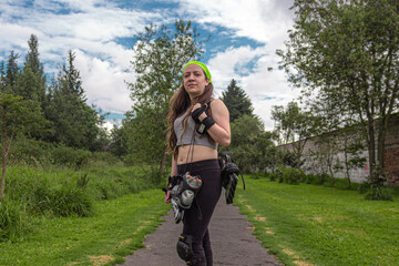 young sporty woman walking with line skates, ready to practice skating.