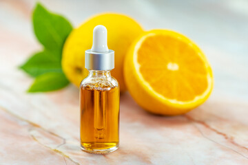 Orange oil in a cosmetic bottle. Natural cosmetics and face care.
