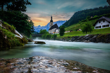 The parish church of St. Sebastian in Ramsau near Berchtesgaden as a long exposure with the river...