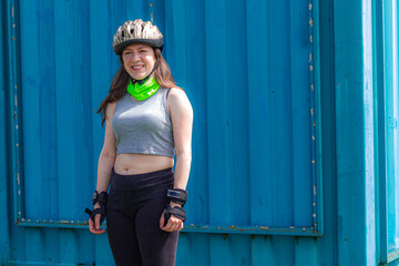 young sporty woman practicing inline skating in an urban setting
