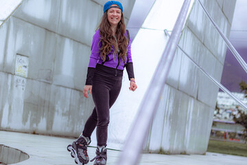 young sporty woman practicing inline skating in an urban setting