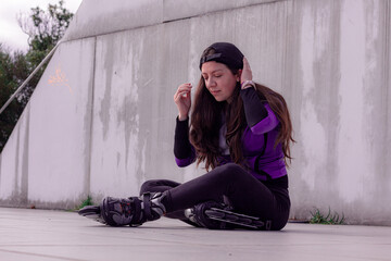 young sporty woman practicing inline skating in an urban setting