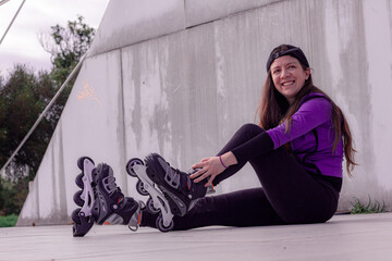 young sporty woman practicing inline skating in an urban setting