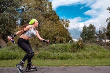 young sporty woman practicing inline skating in an urban setting
