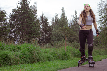 young sporty woman practicing inline skating in an urban setting