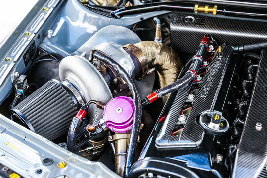 Moscow, Russia - June 4, 2022 boosted car engine. turbocharged car engine. big turbocharger is on sport car engine