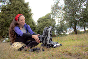 young sporty woman practicing inline skating in an urban setting