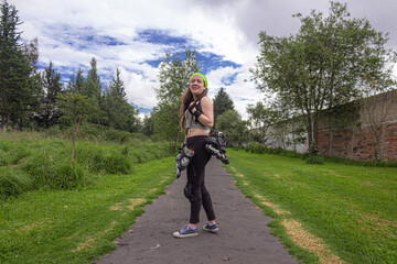 young sporty woman practicing inline skating in an urban setting. High quality photo