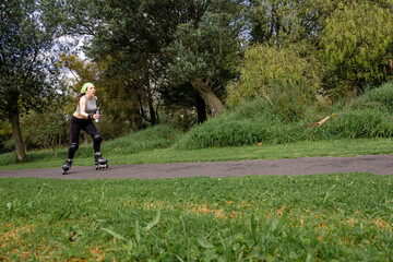 young sporty woman practicing inline skating in an urban setting. High quality photo