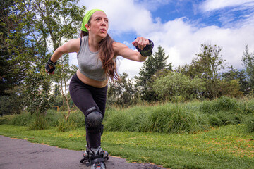 young sporty woman practicing inline skating in an urban setting. High quality photo