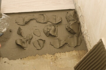 the process of professionally laying tiles on the floor