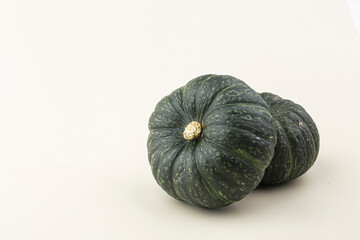 Green mini pumpkin isolated on the white background .