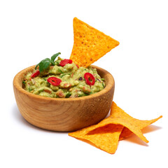 guacamole dip sauce in wooden bowl and nachos chips isolated on white background