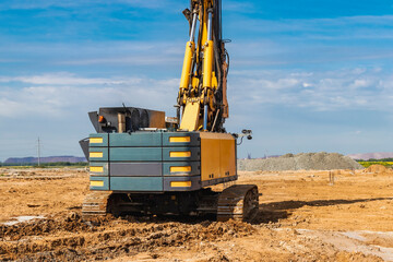 Hydraulic drilling machine at the construction site. Pile field. Modern drilling rig. The device of...