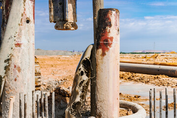 Hydraulic drilling machine at the construction site. Pile field. Modern drilling rig. Pouring concrete into a pile. Work drilling rig when driving bored piles.