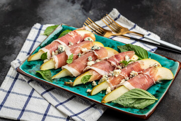 Appetizer with pear, blue cheese and prosciutto ham, Healthy fats, clean eating for weight loss,...