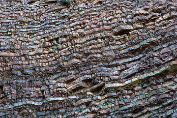 Layered rock texture, abstract stone mountain background