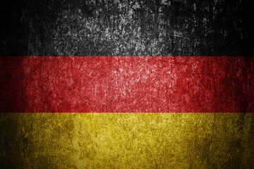 Closeup of grunge German flag. Dirty Germany flag on a metal surface