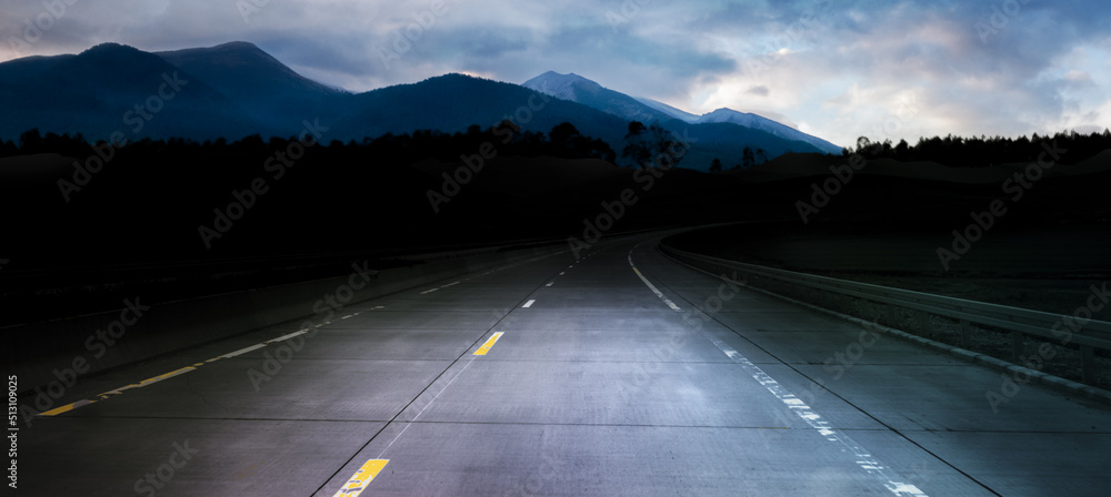 Wall mural dark night road through forest and mountains