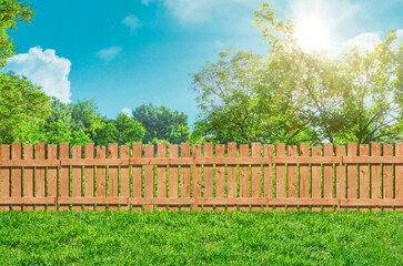 wooden garden fence at backyard and lawn with grass in park