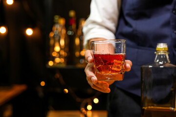Bartender pouring Whiskey, on  bar,