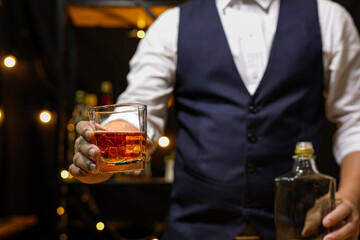 Bartender pouring Whiskey, on  bar,