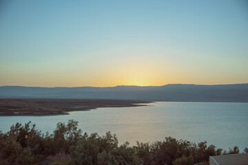 Orange sunrise reflecting off of the Dead Sea. High quality photo
