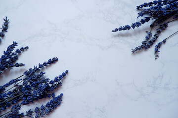  Lavender flowers on White marble background. Copy space. Top view, flat lay. blue dry Lavender flower background.