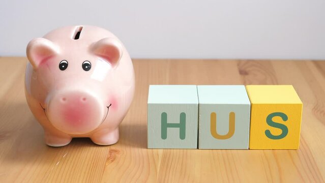 House savings concept. Norwegian, Swedis language word: hus (house). Buying new house.