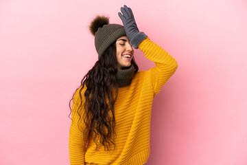 Young caucasian girl with winter hat isolated on purple background has realized something and intending the solution