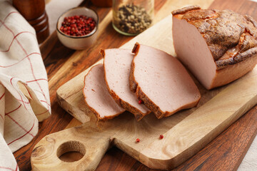 Traditional oven baked bavarian meal leberkäse sliced - meat dish made of corned beef, pork and...