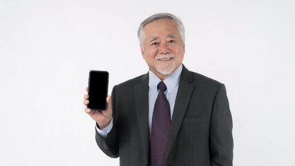 Asian senior businessman , old man with suit feel happy good health showing smart phone with blank screen , black screen isolated on white background , Mock Up Image