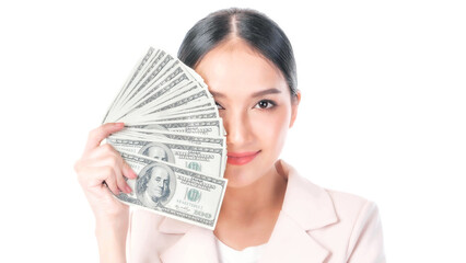 Fototapeta premium Successful beautiful Asian business young woman holding money US dollar bills in hand isolated on white background with copy space , business concept