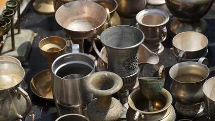 Bronze and metal objects sold on a street flee market. Antiquities at the flee-market.