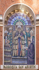 Madrid, Spain. Mosaic of the consecration of Saint Augustine of Hippo in the facade of the Iglesia...