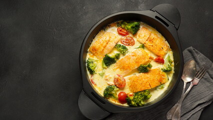 Creamy Garlic Butter Tuscan Salmon. Salmon fillet with cream sauce, cherry tomatoes and broccoli