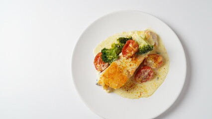 Creamy Garlic Butter Tuscan Salmon. Salmon fillet with cream sauce, cherry tomatoes and broccoli
