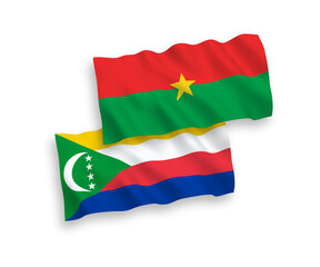 National vector fabric wave flags of Union of the Comoros and Burkina Faso isolated on white background. 1 to 2 proportion.