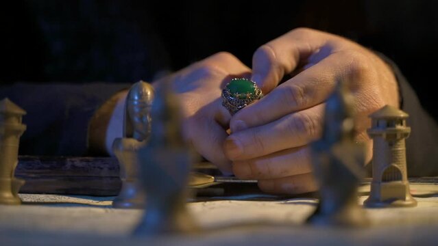 War strategy. Making plans.
Historical soldiers. Chess game. Antiquated map. Green embroidered historical ring detail.
