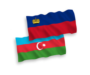 National vector fabric wave flags of Liechtenstein and Azerbaijan isolated on white background. 1 to 2 proportion.