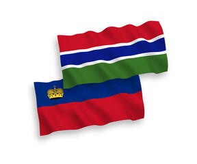 National vector fabric wave flags of Liechtenstein and Republic of Gambia isolated on white background. 1 to 2 proportion.