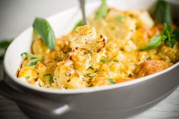 baked cauliflower with vegetables and cheese and scrambled eggs