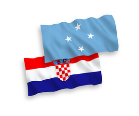 National vector fabric wave flags of Federated States of Micronesia and Croatia isolated on white background. 1 to 2 proportion.