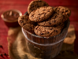 cookies placed on jute with chocolate bowl.